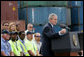 President George W. Bush, joined on stage by port workers, delivers remarks on U.S. trade policy Tuesday, March 18, 2008, at the Blount Island Marine Terminal in Jacksonville, Fla. White House photo by Chris Greenberg