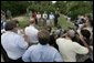 After touring the hurricane damage to Marty and Pat McKenna's orange groves, President George W. Bush addresses the media at the their farm in Lake Wales, Fla., Sept. 29, 2004.   White House photo by Eric Draper