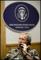 President George W. Bush speaks with the Prime Minister of Lebanon during a phone call at the Bush Ranch in Crawford, Texas, Saturday, Aug. 12, 2006. White House photo by Eric Draper