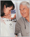 Photo of a female doctor checking the blood pressure of an older man.