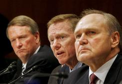 Ford Chief Executive Alan Mulally, center, flanked by General Motors Chief Executive Richard Wagoner, left, and Chrysler Chief Executive Robert Nardelli, testifies.