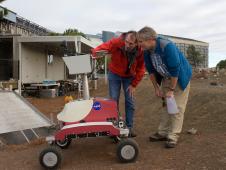 Mark Helper, senior lecturer at the University of Texas, Austin, Tex.; and Kip Hodges, director of the School of Earth and Space Exploration at Arizona State University, Tempe Ariz.; examine science instruments on the K10 Red planetary rover in the Marscape at NASA's Ames Research Center.