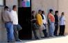 Members of the Laborers Union Local 89 wait outside their local union hall after placing their names on the job list in San Marcos, California November 7, 2008.  REUTERS/Mike Blake (UNITED STATES) 