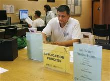Aniba Casavilca fills out a registration form to begin his search for a job at the Verdugo Jobs Center in Glendale, California, November 7, 2008.