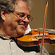 Close-up of Perlman playing violin  		