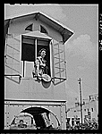 Lady who operates block signals for a railroad crossing. Beaumont, Tex.