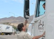 inspector talking with truck driver