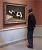 Image: Visitor viewing The Dead Toreador by Edouard Manet in the West Building of the National Gallery of Art. Manet's Ball at the Opera is to the right. Photo: © Dennis Brack/Black Star