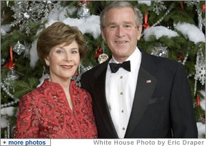 President George W. Bush and Mrs. Laura Bush pose for a holiday portrait in front the White House Christmas Tree Sunday, Dec. 3, 2006. White House photo by Eric Draper