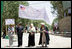 Mrs. Laura Bush, left, assists local officials with the ribbon cutting ceremony June 8, 2008 in Afghanistan at the ground-breaking ceremonies for the 1.96 kilometer Bamiyan road project through the bazaar. The new road will link up with a 1.72 kilometer road from the airport to the town center completed in 2007 with U.S. support.