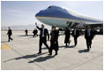 President George W. Bush gives the thumbs-up after Air Force One landed at Bagram Air Base near Kabul, Afghanistan Wednesday, March 1, 2006. The five-hour surprise visit included a meeting with Afghan President Karzai, a ceremonial ribbon-cutting at the U.S. Embassy, and a visit to the troops at Bagram.