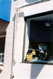 A gearbox, slide rod, roller, front bar, and extension arm reveal that this 19th century facade once featured a retractable awning.  It is likely that with minor repairs the surviving  hardware could again be made operable, recovered with a canvas or acrylic fabric, and reused to service the
storefront. Photo: NPS files.