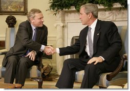 President George W. Bush welcomes NATO Secretary-General Jaap de Hoop Scheffer to the Oval Office Friday, Oct. 27, 2006. White House photo by Kimberlee Hewitt