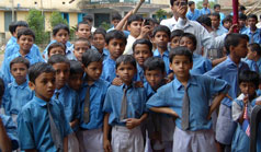 Photo of Assistant Secretary Ameri visiting Shishu Bikash Academy, Sonarpur, a madrassa school in rural Bengal that promotes modern education to disadvantaged Muslim students