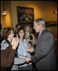 President George W. Bush greets diners Wednesday, Oct. 15, 2008, at the Schnitz Ada Deli and Grill in Ada, Michigan. The President met with business owners from the Grand Rapids area over lunch at the deli to talk about the economy. White House photo by Eric Draper