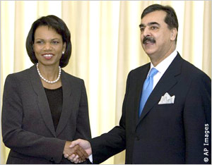 Rice shaking hands with Gilani (AP Images)