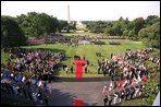 President George W. Bush and Laura Bush stand with visiting President Aleksander Kwasniewski of Poland and his wife, Jolanta Kwasniewska, during the State Arrival Ceremony on the South Lawn Wednesday, July 17, 2002. White House photo by Paul Morse.