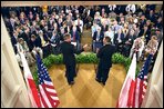 The two Presidents conduct a joint press conference in the East Room July 17. The leaders outlined two initiatives that would encourage stronger military and economic cooperation between Poland and the United States. White House photo by Paul Morse.