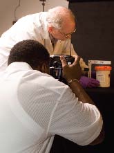 POISU photographers documenting evidence in the FBI Laboratory's photographic studio