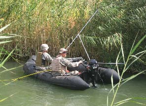 Underwater Search and Evidence Response Team personnel participating in a search for evidence in Iraq in support of an investigation conducted by the FBI's Louisville Field Office