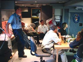 HMRU chemists and HAZMAT officers, along with Rochester fire officials, analyze video images from the Rochester Fire Department's HAZMAT Team inside the HMRU Base of Operations Vehicle.