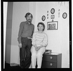 Unidentified couple, a coke worker and his wife, full-length portrait, facing front, at home in Ruhr, West Germany