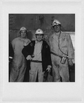 Three unidentified miners, three-quarter length portrait, facing front, in Scotland