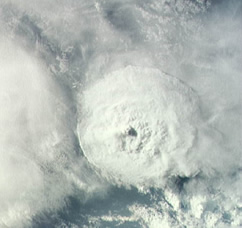 Looking down on a circular cloud formation.