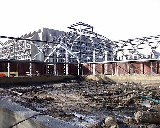 February 1999 - Glass has been removed from the west side of the Conservatory. The foreground shows the west courtyard, former site of the bog garden.