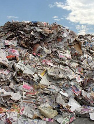 Municipal solid waste: large pile of used newspapers.