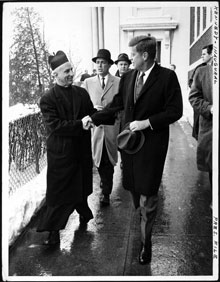 President-elect John F. Kennedy shakes hands with Father Richard J. Casey, the Pastor, after attending Mass at Holy Trinity Church prior to inauguration ceremonies, January 20, 1961 (Library of Congress)