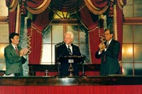 Senator Byrd is welcomed to the Old Senate Chamber by Senators Tom Daschle (left) and Trent Lott (right).