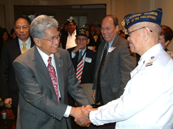Senator Akaka greets Filipino-American World War II veterans at a conference hosted by the Phillipine Embassy in cooperation with the National Federation of Filipino American Association.