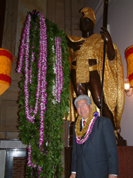 Senator Akaka stands before the lei draped statue of King Kamehameha I, upon completion of the Kamehameha Day celebration in Statuary Hall, U.S. Capitol.