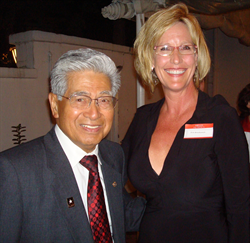 Erin Brockovich poses with Senator Akaka at a Government Accountability Project whistleblower award ceremony.  Akaka received an honorary silver whistle for his work defending government workers who put their careers on the line to expose fraud and waste.