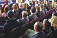 Image: Business people sitting in an auditorium watching a presentation.