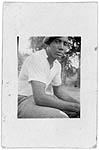 African American Man, Sitting Outdoors