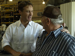 Senator Bayh shaking hands with a constituent