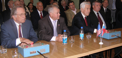 U.S. Senator Dick Lugar (right), former Senator Sam Nunn (left) and U.S. Ambassador to Russia Bill Burns (not pictured) became the first Americans to ignite the solid fuel in a rocket motor that was removed from an SS-25 intercontinental ballistic missile. Sergei Shevchenko (center), a senior official at the missile technologies directorate of Russia’s space agency, gave the destruction order.