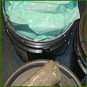 Cans of paint concealed 61 pounds of marijuana a smuggler was trying to bring across the border.