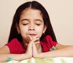 Close-up of girl praying