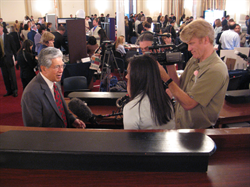 Senator Akaka talks with reporters following a speech at Financial Literacy Day on the Hill, at the Cannon House Office Building.  Senator Akaka, a former teacher, supports efforts to teach young people money management skills, so they'll be on solid footing for the future.