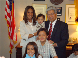 Senator Akaka welcomes Barbara Favela to his office.  Barbara's husband Steve, a Honolulu Police Officer, was tragically killed in the line of duty while protecting the President of the United States in a motorcade last year at Hickam Air Force Base.  Accompanying Barabara are their children: Keahi (8), Kiana (6), Matthew (3) and Jacob (9 months).  Sen. Akaka offered Barbara his sympathy for her loss, reminded her of the important and honorable work Steve did as a member of the Honolulu Police Department, and assured her that her husband will never be forgotten.