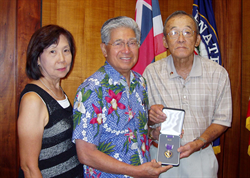 Senator Akaka with former Marine Sergeant Thomas Tsuda and his wife, Jane.  Tsuda stopped by to thank Senator Akaka for his help in obtaining a long deserved Purple Heart for injuries he sustained in the Korean War 54 years ago.  

