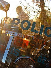 Photo of the reflective windshield of a police motorcycle.