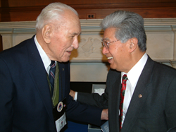 Senator Daniel K. Akaka shares a light-hearted moment with Pearl Harbor survivor Ted Sawick.