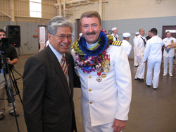 Senator Akaka congratulates Navy Captain Mark Darrah, outgoing commander of the Pacific Missile Range Facility, at a Change of Command ceremony April 4 at Barking Sands, Kauai