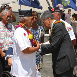 Senator Akaka pins the Silver Star onto Clarence Young for his service to the U.S. in 1951. 