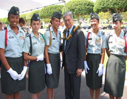 Senator Akaka and the young women of the Kaimuki H.S. R.O.T.C. before Memorial Day Ceremonies at the National Memorial Cemetery of the Pacific. 