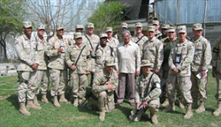 Senator Daniel Akaka pictured with soldiers from the 25th Infantry Division. Picture taken in Afghanistan in Spring 2004.